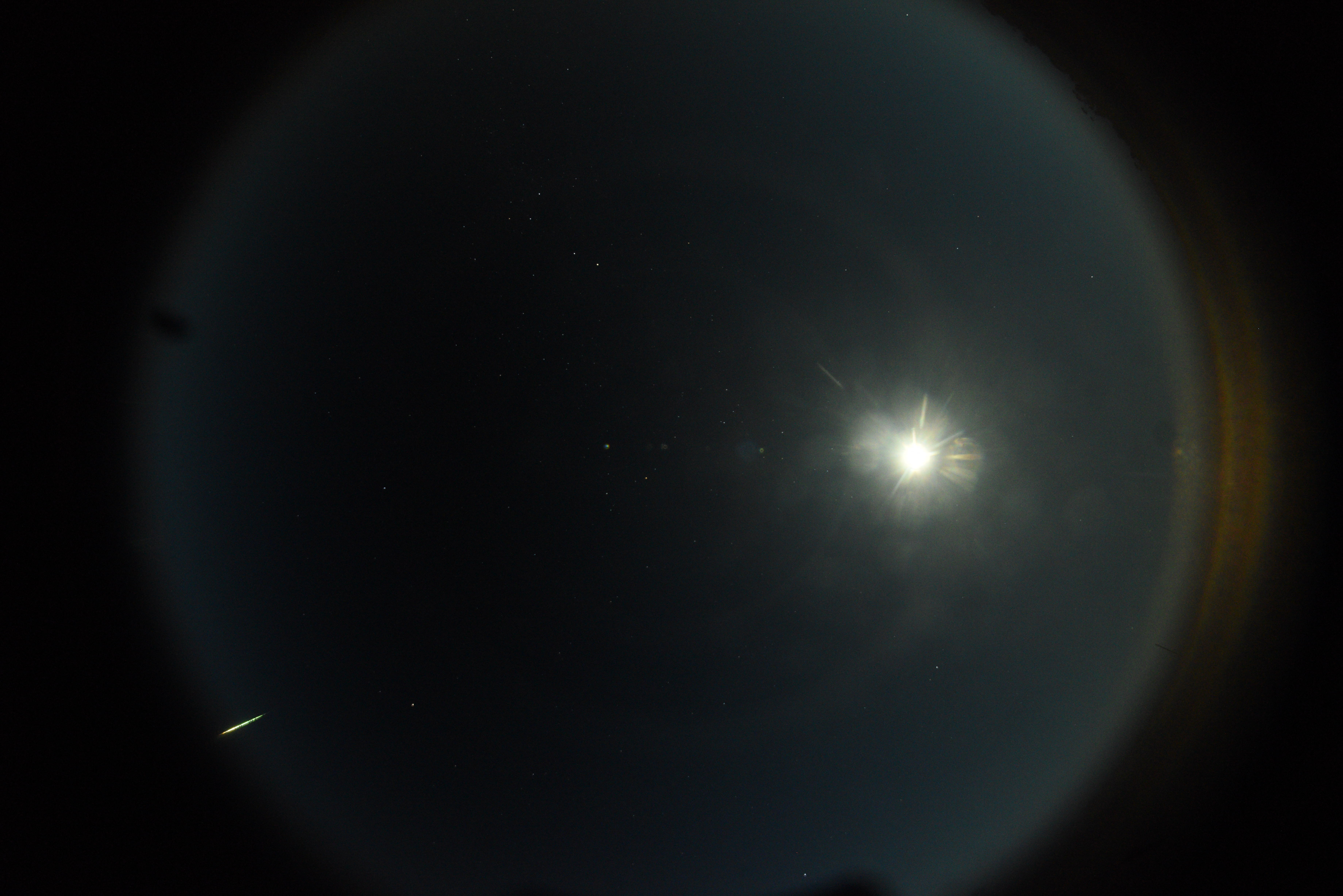 Observation of the fireball from Mundrabilla station. The fireball is in the bottom left, and the bright spot in the middle is the Moon.