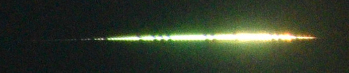 A zoomed version of the fireball, from Kybo station. The dark spots are added by a liquid crystal shutter, which prints timing information into the image so we can determine the velocity.